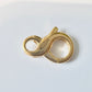 Fermoir mousqueton or 18 carats, forme de l'infini en or jaune 18k 750